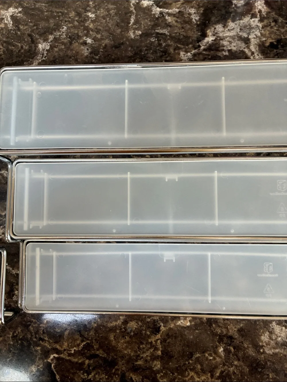 Clear plastic & metal display shelves slide together